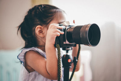 Portrait of woman photographing