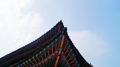 High section of built structure against blue sky