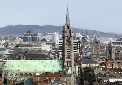 Buildings in city against sky