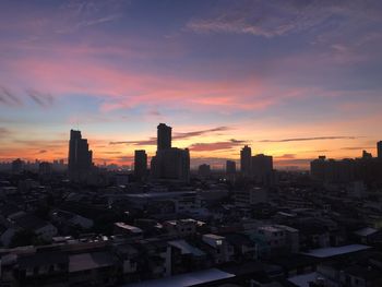 Buildings against sky during sunset