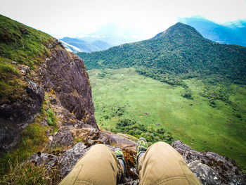 Low section of person on rock