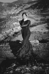 Woman standing on rock