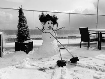 Man in snow against sky