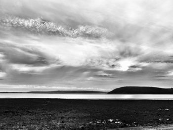 Scenic view of sea against cloudy sky