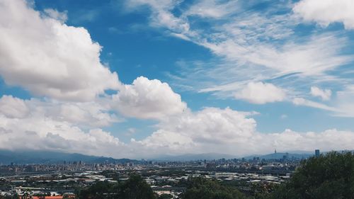 Aerial view of cityscape against sky