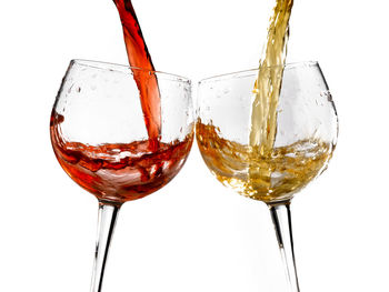 Close-up of wine glass against white background