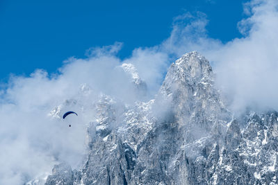 Low angle view of snowcapped mountain against sky