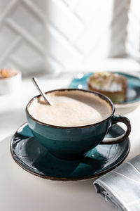 Close-up of coffee cup on table
