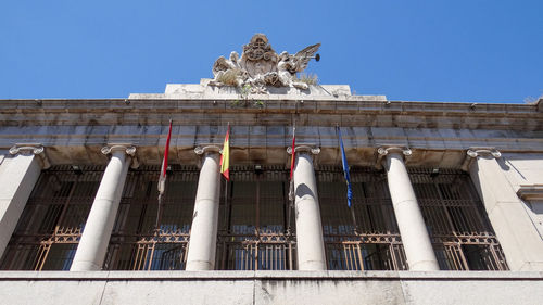 Low angle view of statue against sky