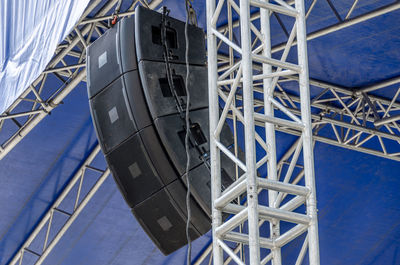 High angle view of communications tower against blue sky