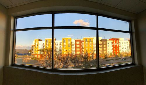 Buildings seen through glass window