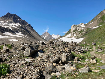 Scenic view of mountains against clear blue sky
