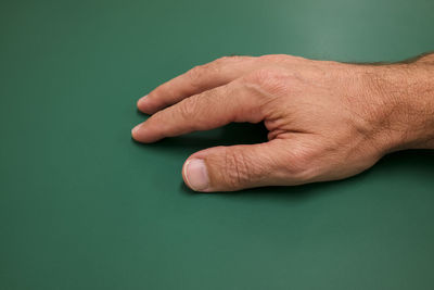 Close-up of hands on table