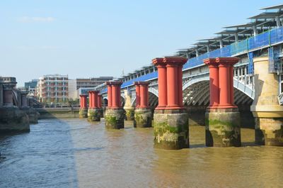 Bridge over river against clear sky