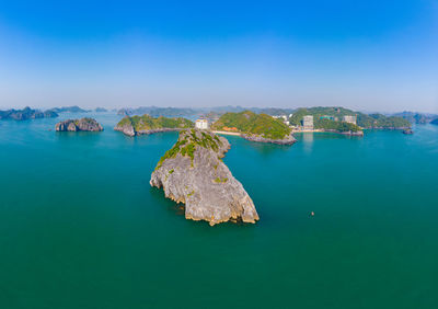 High angle view of bay against blue sky