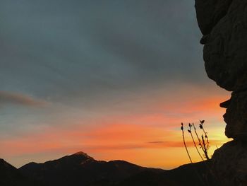 Silhouette mountains against sky during sunset