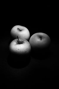 Close-up of apple against black background