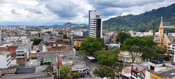 High angle view of buildings in city against sky