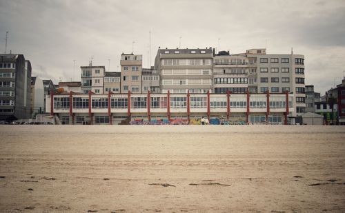 Buildings in city against sky