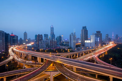 High angle view of light trails on road in city