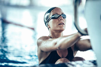 Portrait of man swimming in pool