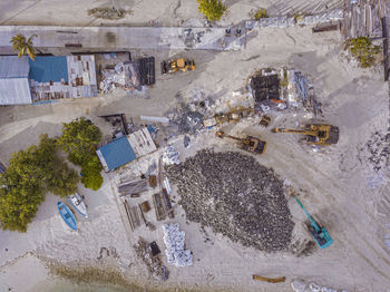 Maldives, kaafu atoll, himmafushi, aerial view of small construction site on sandy island