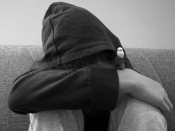 Low section of woman standing against sky