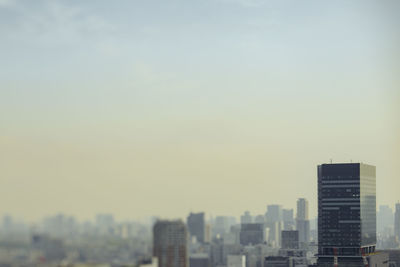 Modern buildings in city against sky