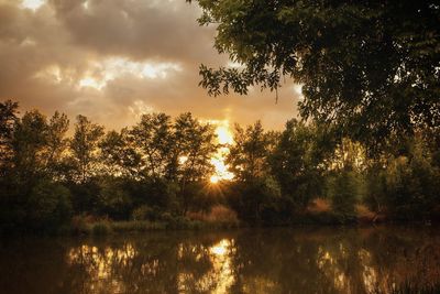 Scenic view of lake against sky during sunset