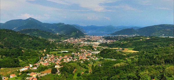 High angle view of townscape and mountains against sky