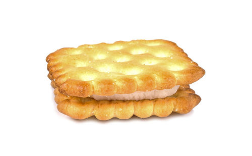 Close-up of bread in plate against white background