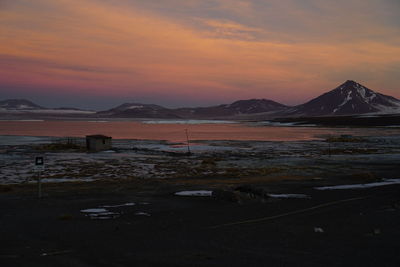 Scenic view of lake against sky during sunset