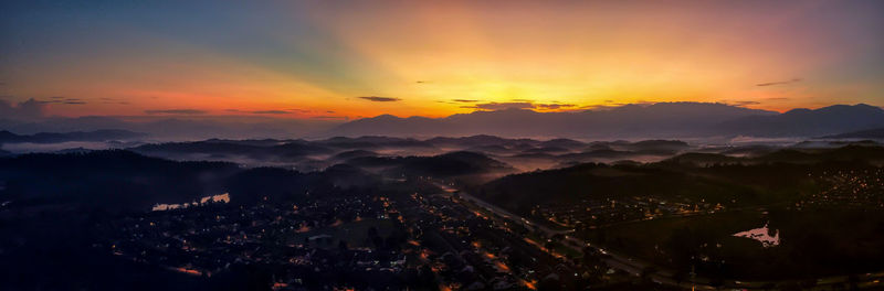 High angle view of cityscape against sky during sunset
