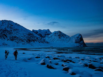 Scenic view of snowcapped mountains against sky during winter
