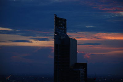 Low angle view of building against sky during sunset