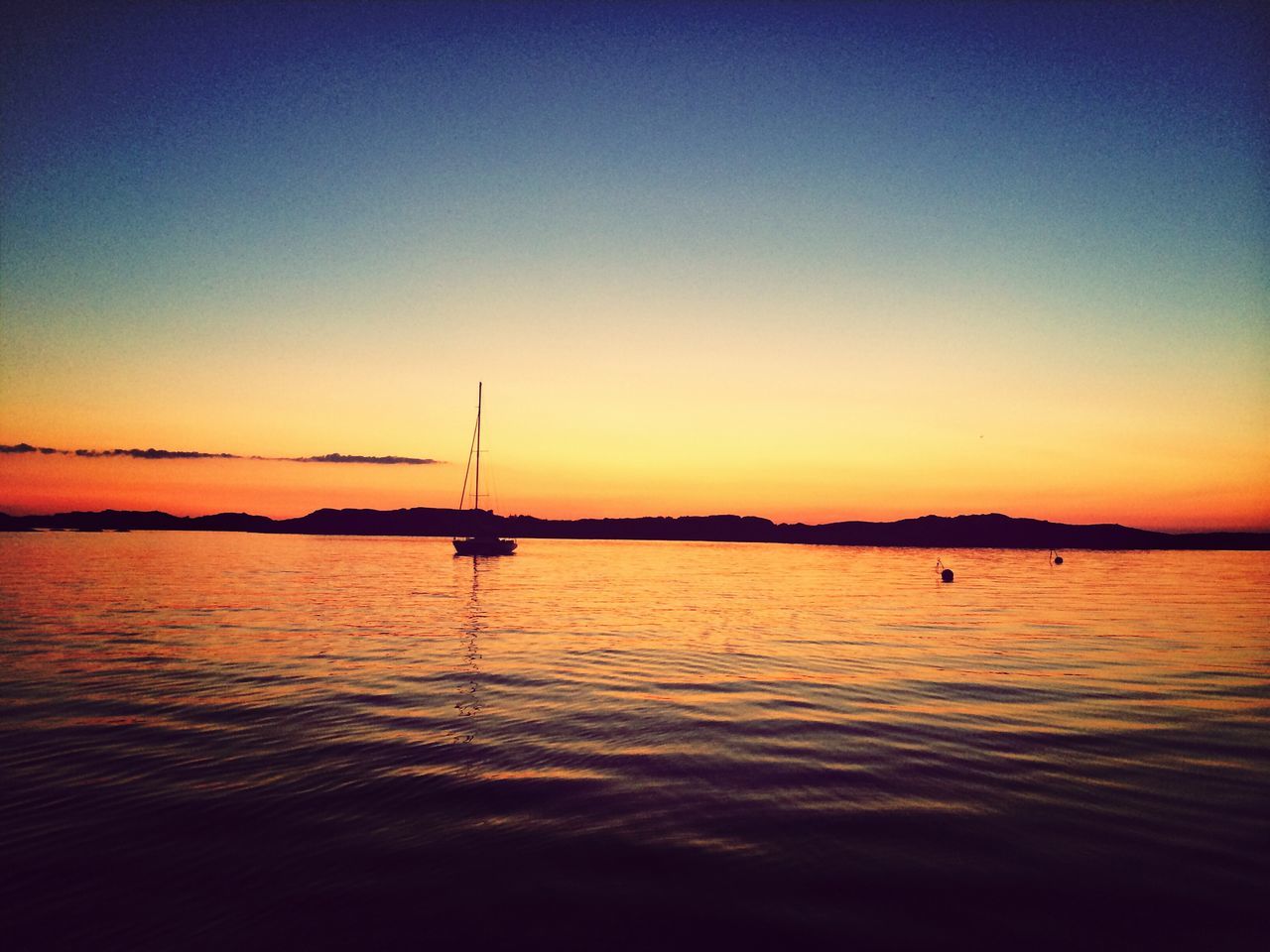 sunset, water, orange color, tranquil scene, sea, scenics, tranquility, silhouette, transportation, nautical vessel, beauty in nature, clear sky, copy space, boat, reflection, waterfront, nature, idyllic, mode of transport, dusk