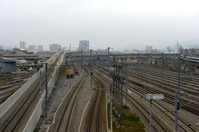 High angle view of railroad tracks in city against clear sky