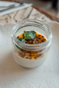 A glass of passion fruit panna cotta