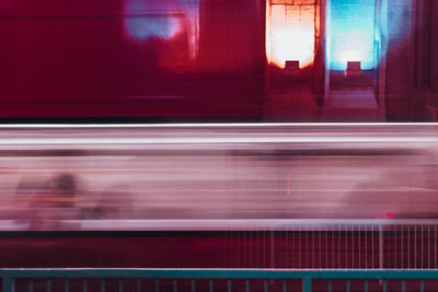 Blurred motion of train at railroad station