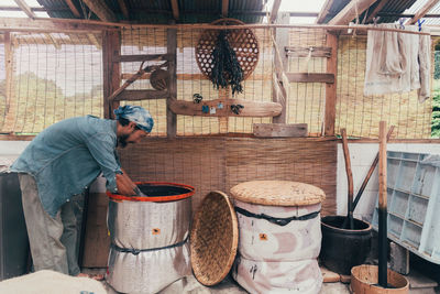 Man working in basket at market