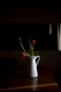 Close-up of red flowers on table