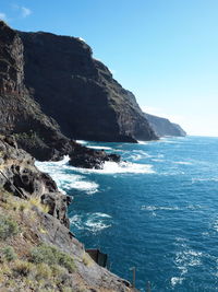 Scenic view of sea against clear blue sky