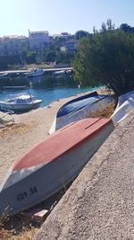 Boats moored on sea against sky