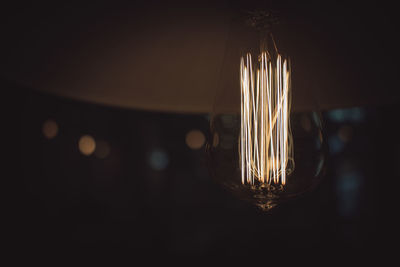 Close-up of illuminated light bulb