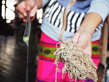 Midsection of woman holding food