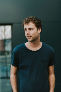 Portrait of young man looking away