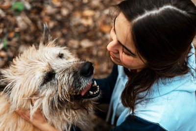 High angle view of woman with dog in park