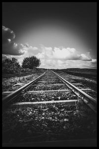 Surface level of railroad tracks against sky