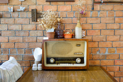 Dry flower on an old vintage radio in cafe
