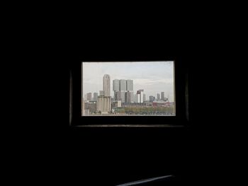 View of cityscape through window